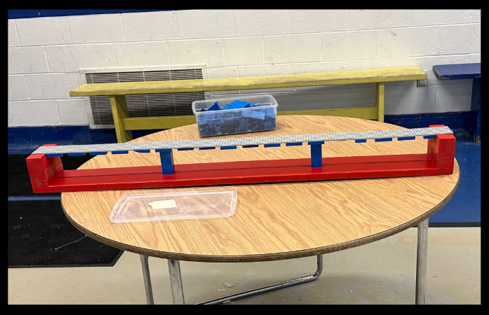 finished lego bridge on a table